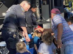 Officers speaking to community members