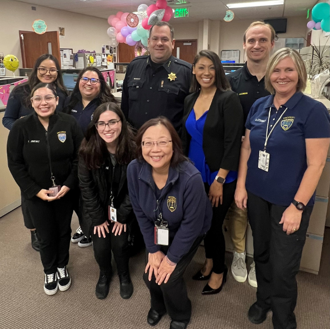 Group of Records staff standing together smiling.